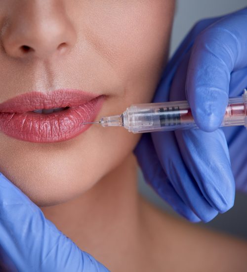 hands of expert injecting botox